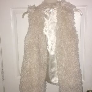 White fuzzy vest
